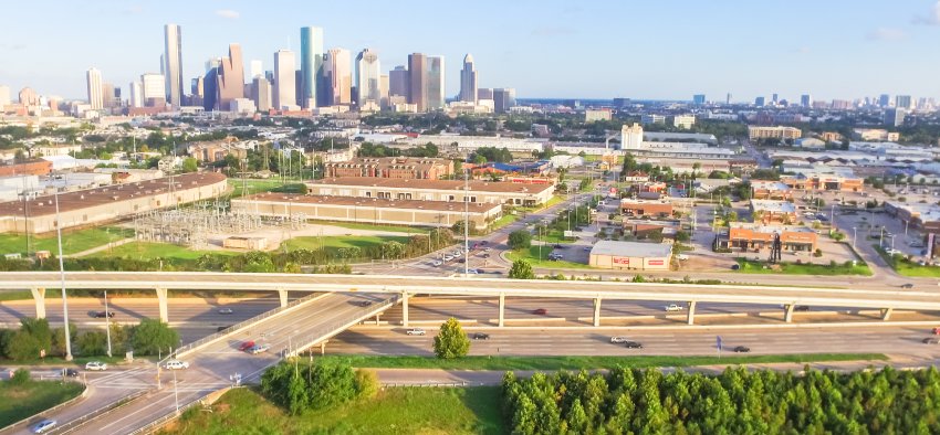 Lonestar Key Master – Professional locksmith services in Katy, Texas, featuring an aerial view of highways, commercial areas, and the Houston skyline. 24/7 locksmith solutions.